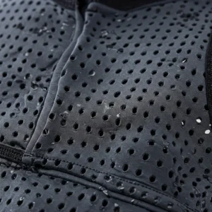 Detail of the breathable, moisture-wicking fabric used in a bike cooling vest for optimal airflow.