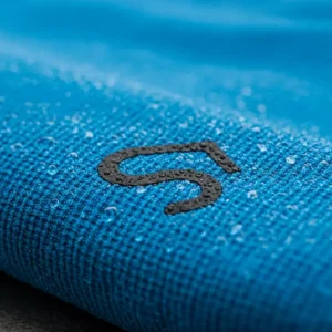 Close-up of a blue cooling towel with a custom logo, showcasing branding on a refreshing sports accessory.
