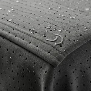 Detailed fabric texture of a cooling towel featuring a subtly embroidered logo, emphasizing material quality and branding.