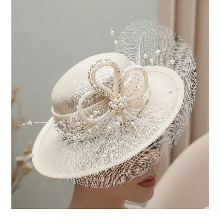 Depiction of an elegant small hat designed for a wedding guest, featuring delicate embellishments and a refined look for ladies.
