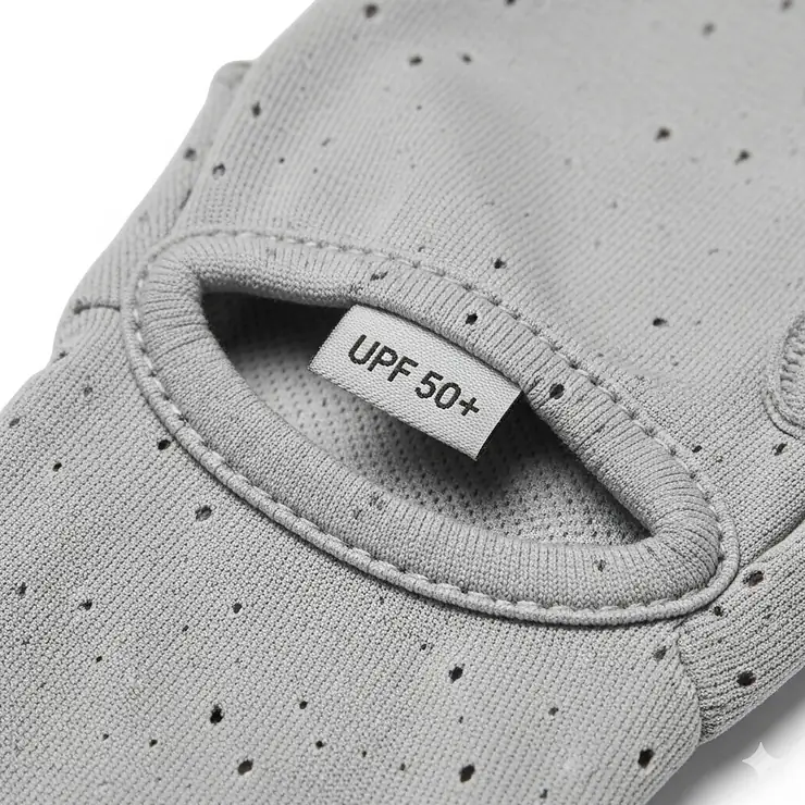 A detailed close-up of the fabric of sun gloves, highlighting the lightweight, breathable, and UV-protective material designed for extended hiking trips.