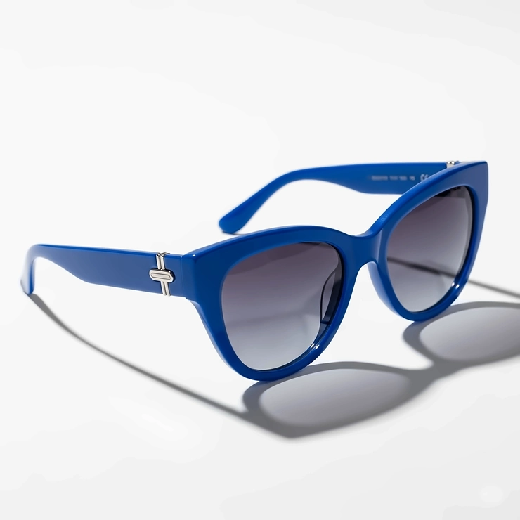 A pair of chic, cat-eye style sunglasses with a vibrant blue frame, ideal for a bold and fashionable look.
