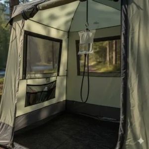 An illustration of the interior of a camp shower tent, showing a hanging hook for a shower bag and a mesh floor for drainage.