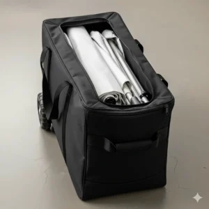 A compact, folded 10x15 pop up canopy stored neatly inside its wheeled carrying bag, emphasizing its portability and convenience for transport and storage.