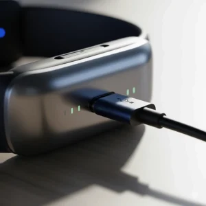 The image depicts a cooling wristband being charged via a modern USB-C cable, highlighting its convenience and portability.