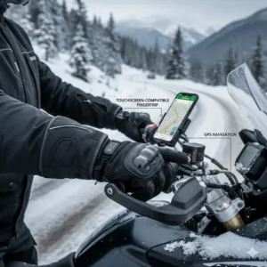 Close-up of a fingertip of a motorcycle glove using a smartphone screen for GPS.