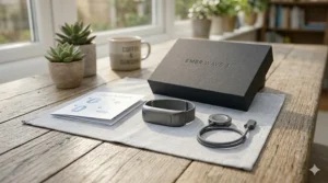 The complete unboxing layout of the Embr Wave smart cooling bracelet kit including the magnetic charging puck, USB cable, and quickstart manual.
