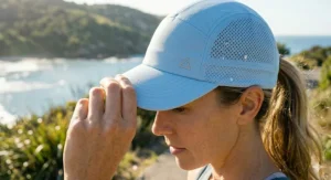 Close-up shot of the breathable mesh panel and moisture-wicking fabric on stylish cooling caps for women.