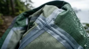 Detailed view of heat-sealed taped seams on a waterproof jacket