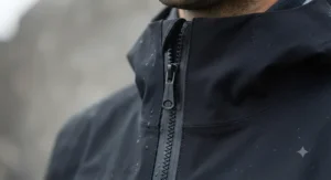 Close-up of water-resistant zipper on black men's rain jacket