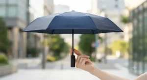 Lightweight automatic open close umbrella being held easily with two fingers