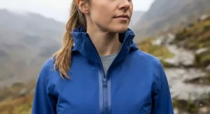 A fully zipped rain jacket with a collar that fits comfortably around the neck without being too tight or too loose.