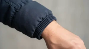 An 800 fill down jacket for men over 6 feet highlighting the long sleeve construction and extended cuffs.